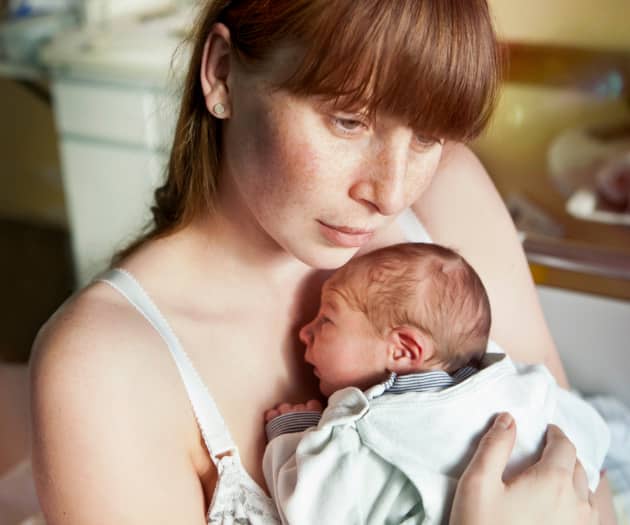 New mom holding newborn