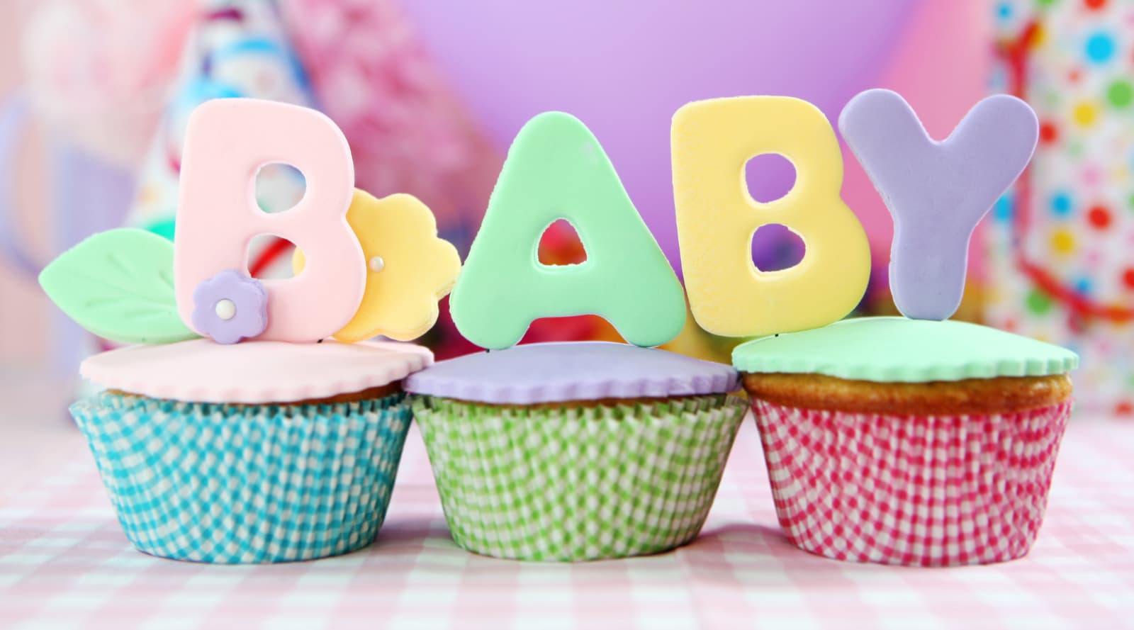 Cup cakes with baby decorations