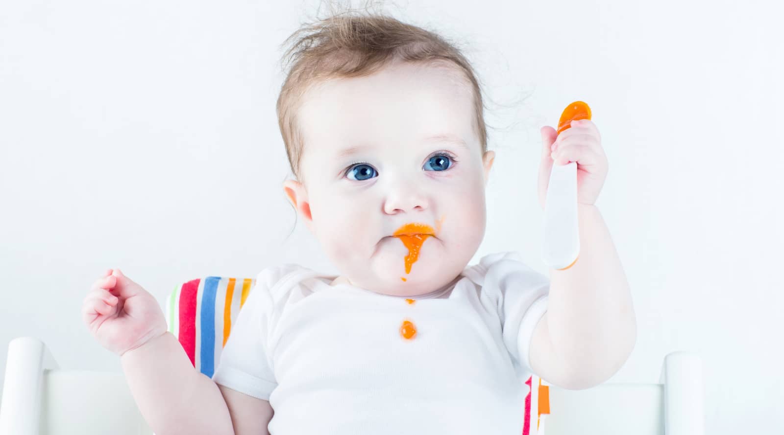 Baby eating pureed food