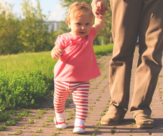 toddler-teaching-baby-to-walk