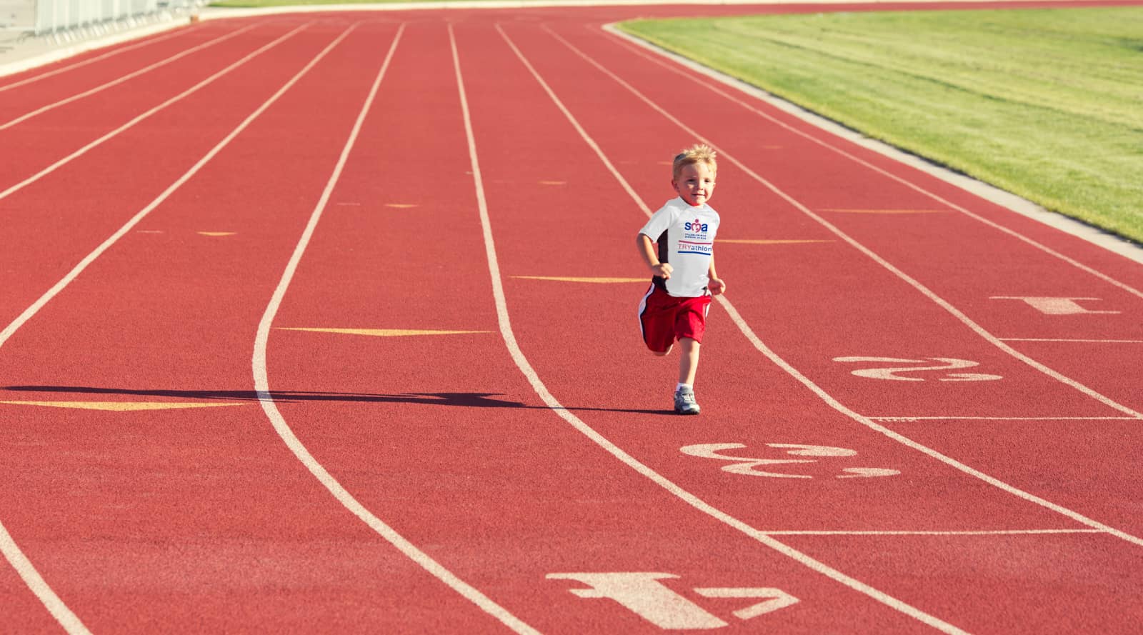 Child on running track