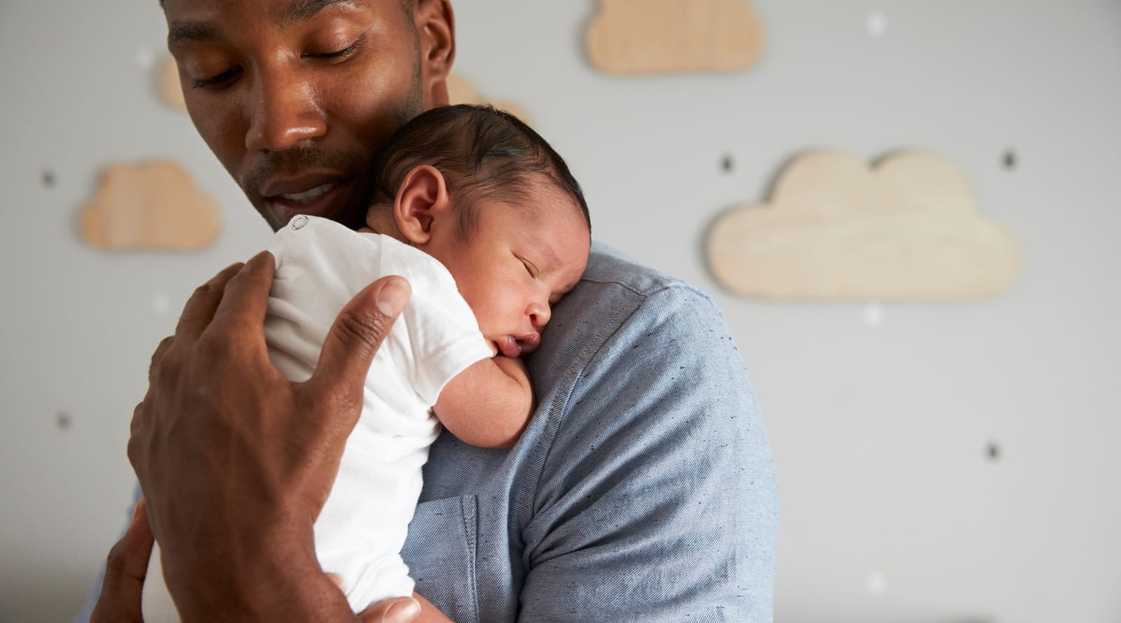 parent holding a newborn baby